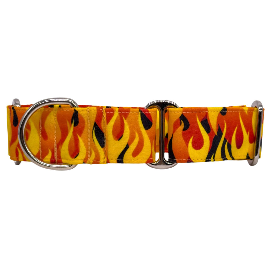 A martingale dog collar with a bold flame pattern in shades of yellow, orange, and black. The collar includes two shiny silver metal rings and an adjustable slider, designed for a secure and stylish fit.