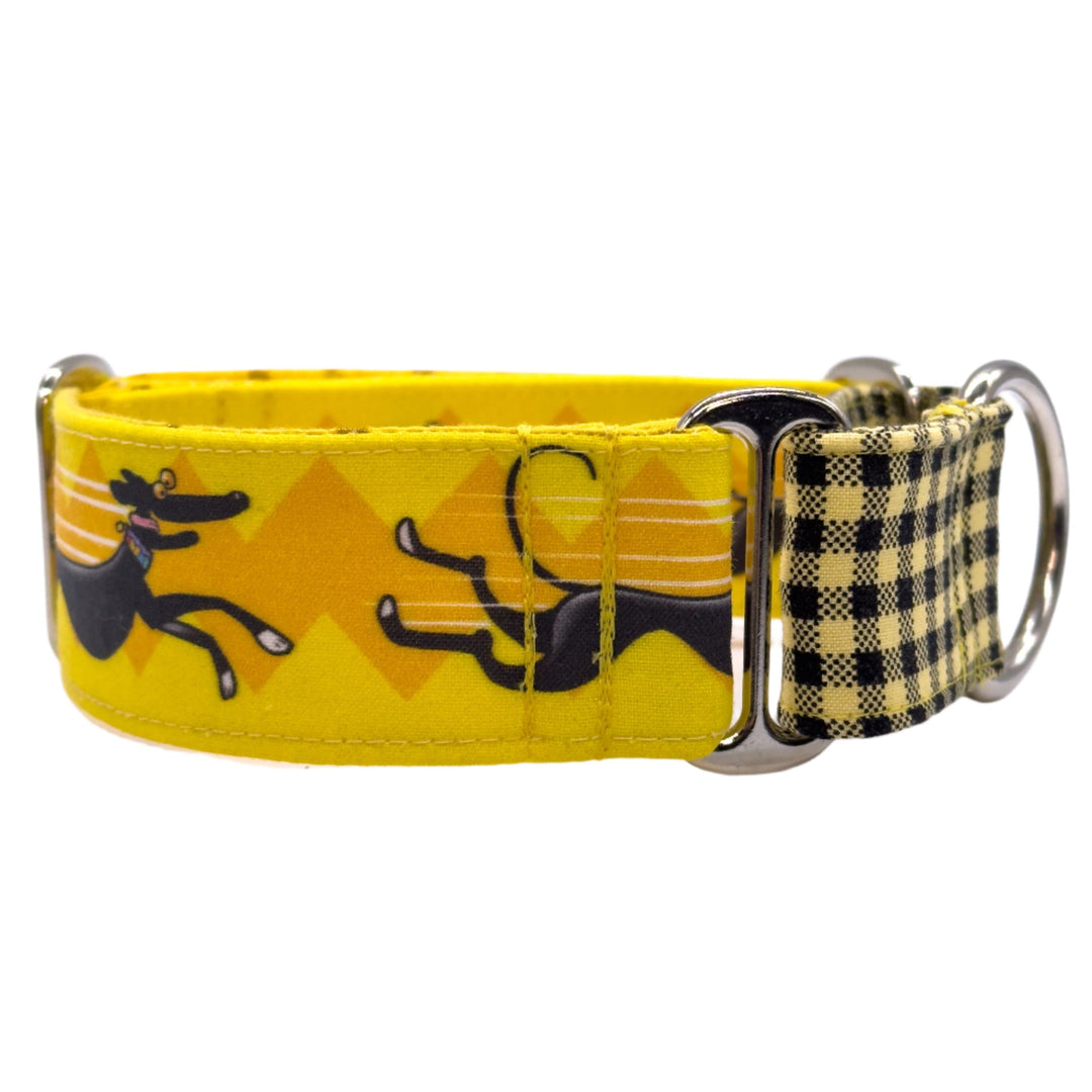 Side view of bright yellow martingale collar with black greyhound